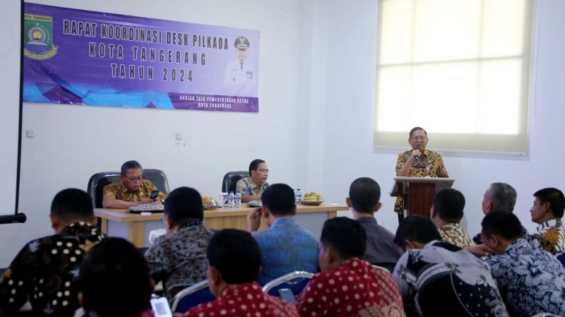 Sekretaris Daerah (Sekda) Kota Tangerang, Herman Suwarman, membuka Rapat Koordinasi Dukungan Elemen Satuan Kerja (DESK) Pilkada Kota Tangerang Tahun 2024, yang berlangsung di Gedung Bhakti Karya, Modernland, pada hari Kamis (05/09). 