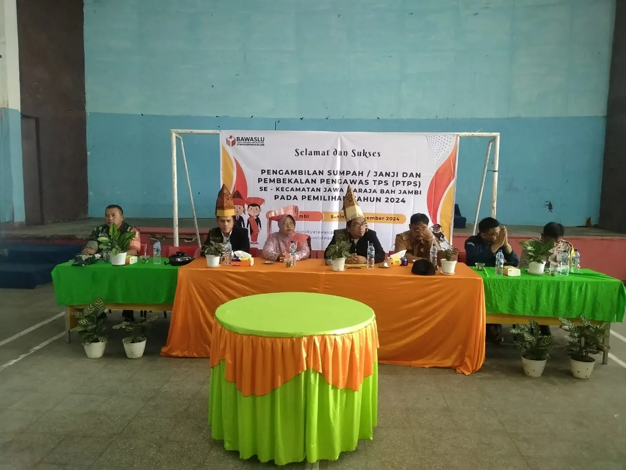 Polsek Tanah Jawa Hadiri Pelantikan PTPS: Upaya Polri Wujudkan Pilkada Damai di Jawa Maraja Bah Jambi